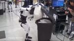 In the clip, Optimus is seen stirring a pot with a spoon, vacuuming the floor, and using a brush and dustpan to clean a table, all while calmly following instructions (Image source: @elonmusk/X)