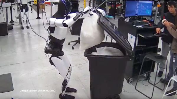 In the clip, Optimus is seen stirring a pot with a spoon, vacuuming the floor, and using a brush and dustpan to clean a table, all while calmly following instructions (Image source: @elonmusk/X)