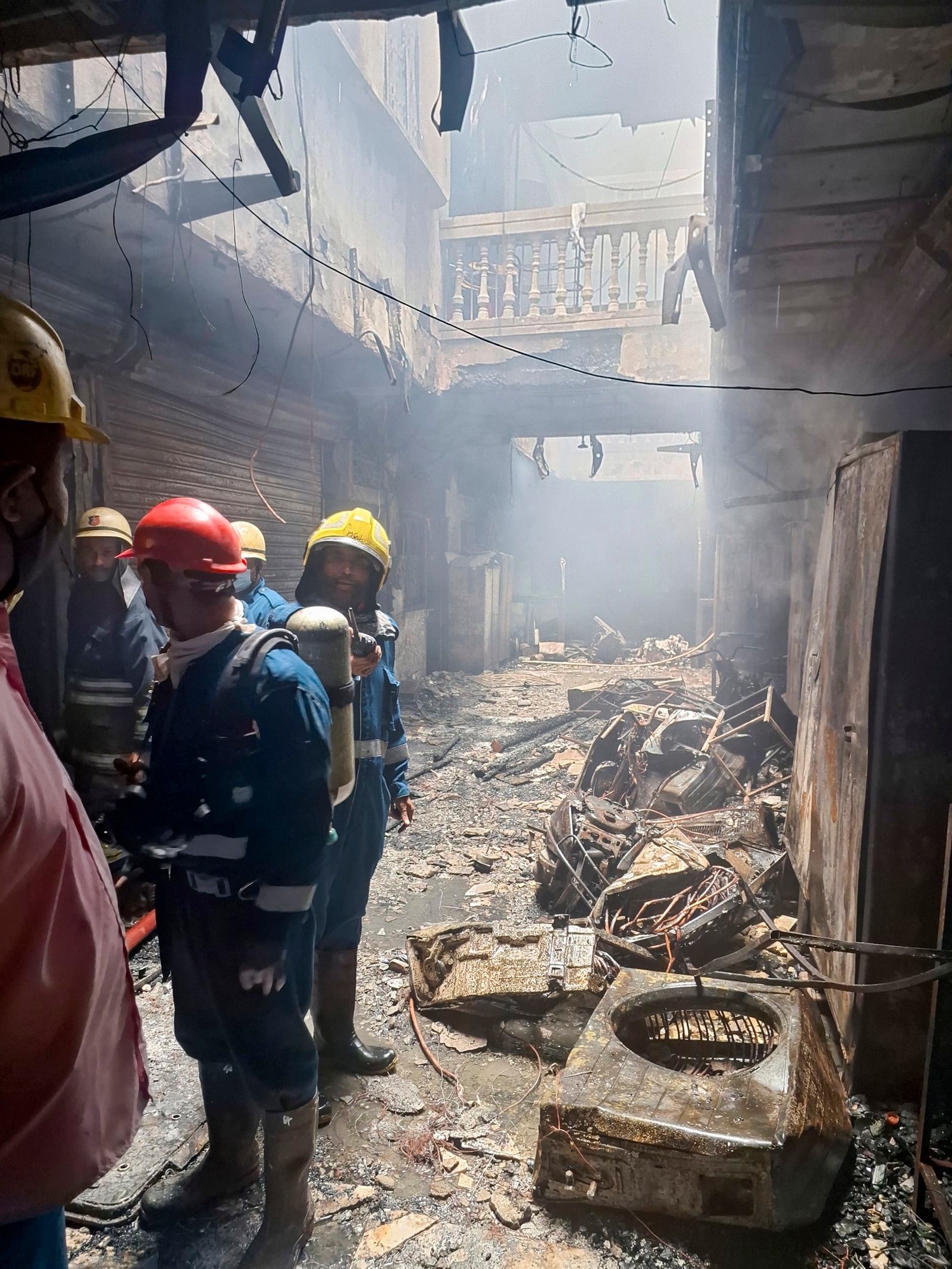 Firefighters at the site after a fire broke out in a building near Charminar in Hyderabad on Sunday