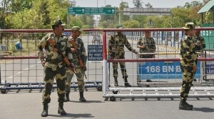 Indian Border Security Force soldiers stand guard at the barricade on the road leading to the Attari-Wagah border