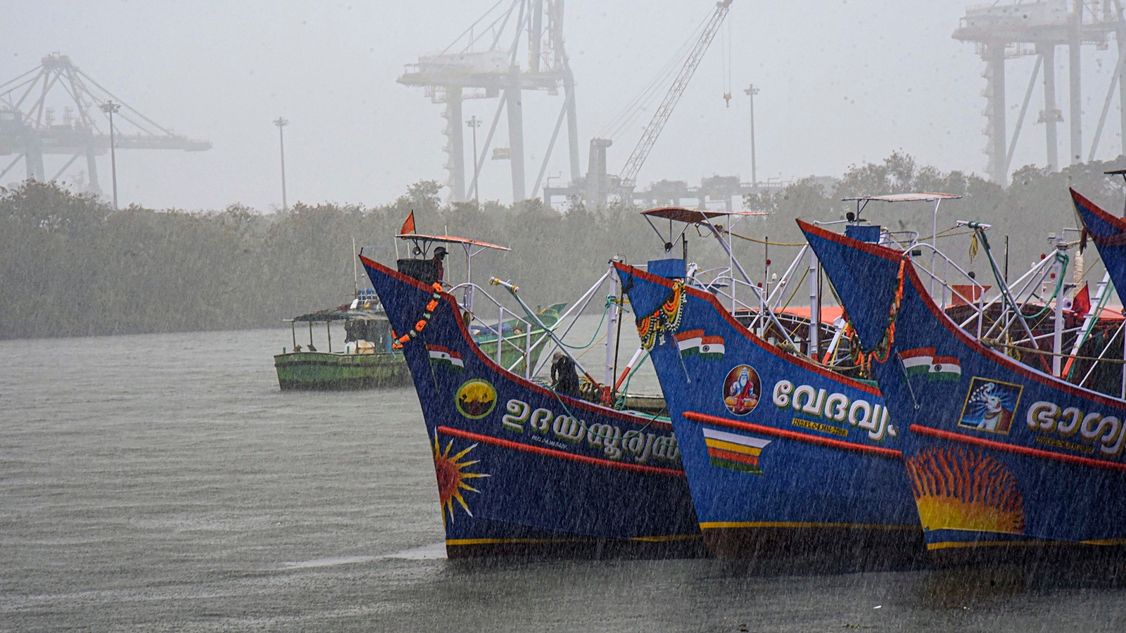 Kerala Monsoon: Boats anchored amid a heavy rain in Kochi on Friday