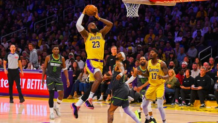 Los Angeles Lakers forward LeBron James (23) shoots as Minnesota Timberwolves guard Nickeil Alexander-Walker (9) defends during the first half in Game 5 of an NBA basketball first-round playoff series Wednesday, April 30, 2025, in Los Angeles. (AP Photo)