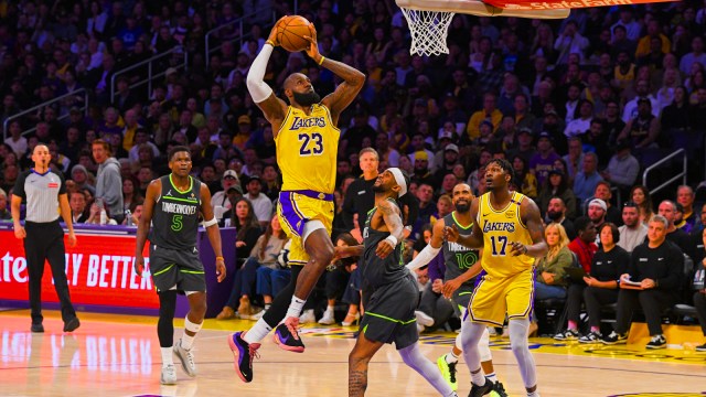 Los Angeles Lakers forward LeBron James (23) shoots as Minnesota Timberwolves guard Nickeil Alexander-Walker (9) defends during the first half in Game 5 of an NBA basketball first-round playoff series Wednesday, April 30, 2025, in Los Angeles. (AP Photo)
