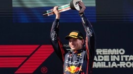 Red Bull driver Max Verstappen of the Netherlands celebrates on the podium after winning the Italian Emilia Romagna Formula One Grand Prix, at the Enzo and Dino Ferrari racetrack in Imola, Italy, Sunday, May 18, 2025. (AP Photo)