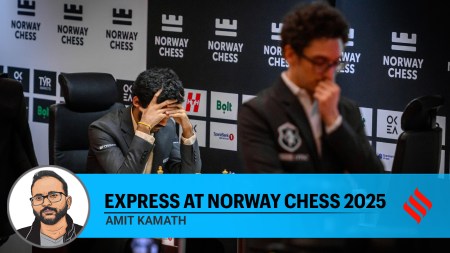 World champion Gukesh Dommaraju contemplates his next move as his opponent Fabiano Caruana walks in the playing hall in round 4 of the Norway Chess tournament in Stavanger. (PHOTO: Michal Walusza via Norway Chess)