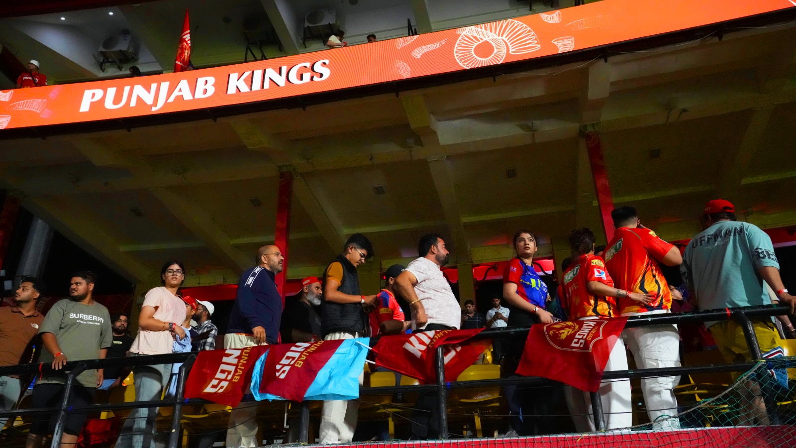 Spectators leave the stands after authorities evacuated the stadium during the Indian Premier League cricket match between Punjab Kings and Delhi Capitals at Himachal Pradesh Cricket Association Stadium in Dharamshala, India, Thursday, May 8, 2025. (AP Photo)