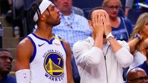 Golden State Warriors' Stephen Curry, right, and Buddy Hield react to a missed shot in the second half of Game 5 of an NBA basketball second-round playoff series, Wednesday, May 14, 2025, in Minneapolis. (San Francisco Chronicle via AP)