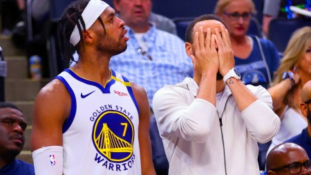 Golden State Warriors' Stephen Curry, right, and Buddy Hield react to a missed shot in the second half of Game 5 of an NBA basketball second-round playoff series, Wednesday, May 14, 2025, in Minneapolis. (San Francisco Chronicle via AP)