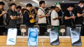 Customers line up at an Apple Store in Shanghai, China, Sept. 23, 2023. White House and congressional officials have been scrutinizing Apple’s plan to strike a deal to make Alibaba’s AI available on iPhones. (Qilai Shen/The New York Times)