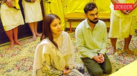 While one of the videos shows Virat Kohli and Anushka Sharma arriving in Vrindavan by car, the photos feature the couple kneeling before Premanand Govind Sharan at his ashram.