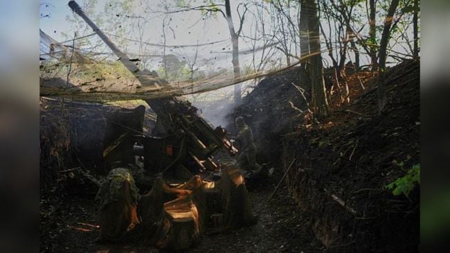 In this photo, taken on May 23, 2025 and provided by Ukraine's 127th Separate Brigade of the Territorial Defence press service, soldiers fire a canon towards Russian army positions near Kharkiv, Ukraine, Friday, May 23, 2025, (Anatolii Lysianskyi/Ukraine's 127th Separate Brigade via AP)