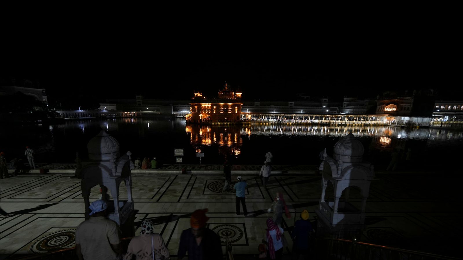 People at the Golden Temple during a blackout, amid escalating tension between India and Pakistan, in Amritsar, Punjab, Thursday, May 8, 2025. (PTI Photo