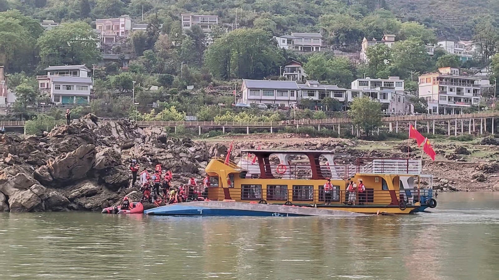At least 10 killed after sudden storm capsizes four boats in