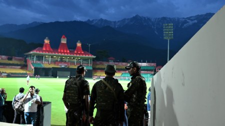 Security personnel guarding at the HPCA Stadium on the eve of the IPL Match between Punjab KIngs and Delhi Capitals at Dharamshala in Himachal Pradesh on Wednesday. Express Photo by Rohit Jain Paras