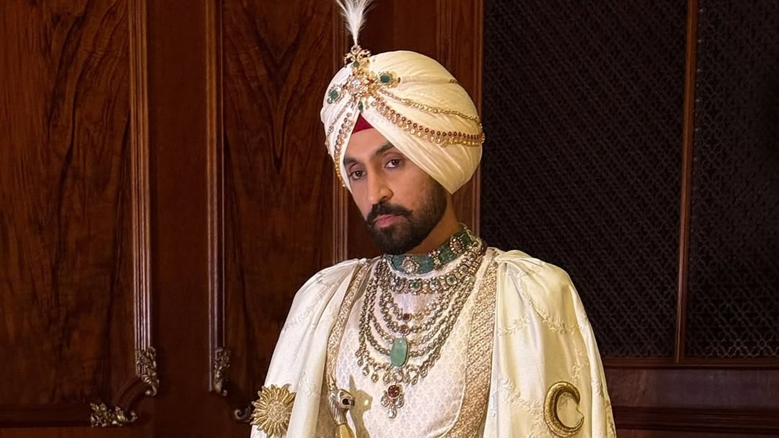 Diljit Dosanjh debuts his 'Maharaja of Patiala' look at the Met Gala in a white cape with the Punjabi mool mantra and the state's map embroidered on it | Fashion News -