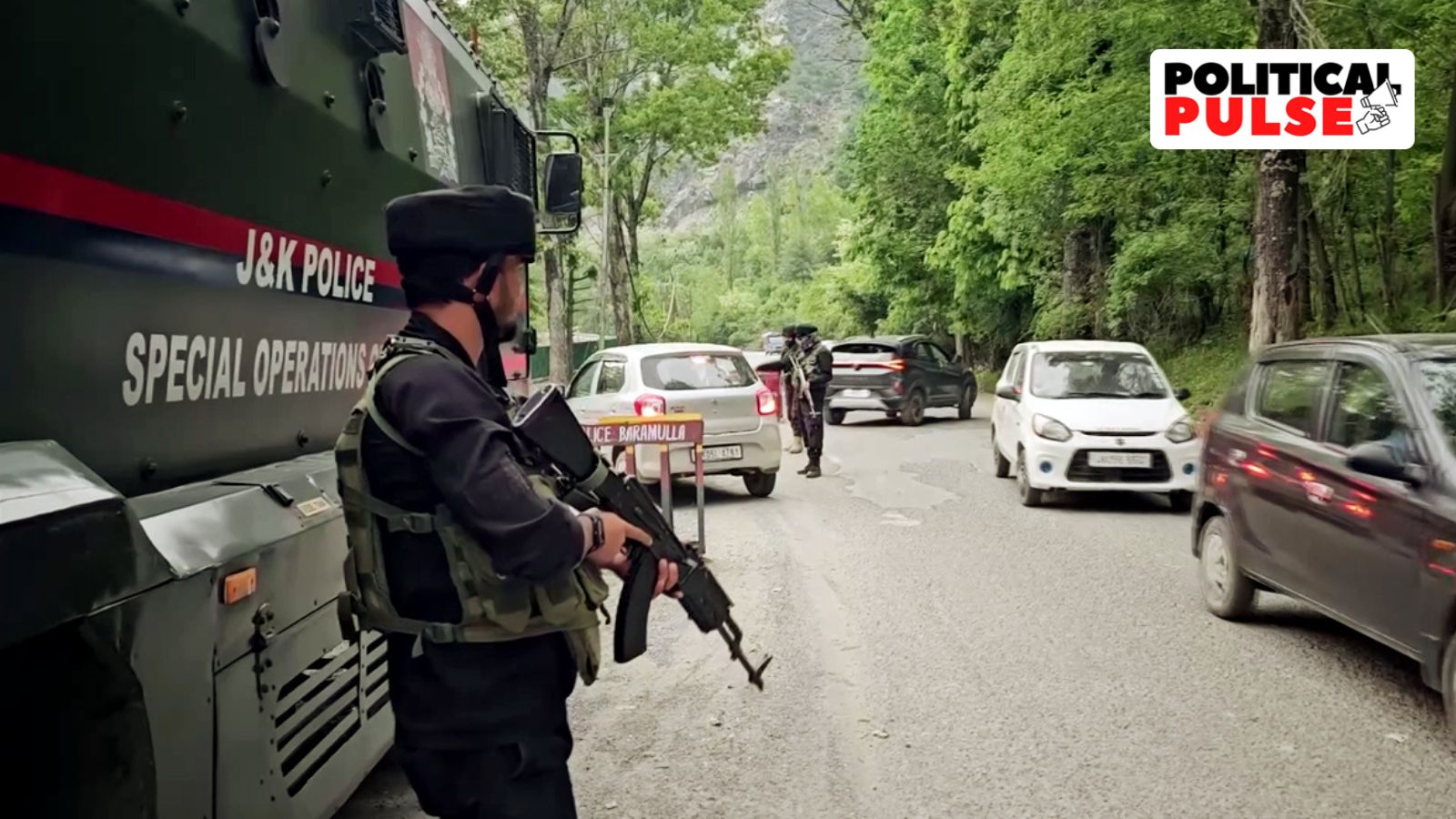 Security personnel stand guard in an area on high alert against terror associates, in Baramulla on Thursday. (ANI Photo)