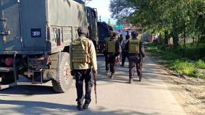 Security personnel undertake a cordon and search operation at Nader Tral area of Awantipora, in Pulwama district
