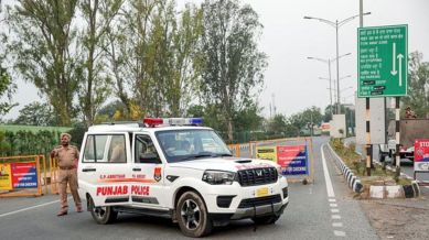 Punjab Police stand guard after the closure of Sri Guru Ramdas Ji International Airport in Amritsar on Wednesday.