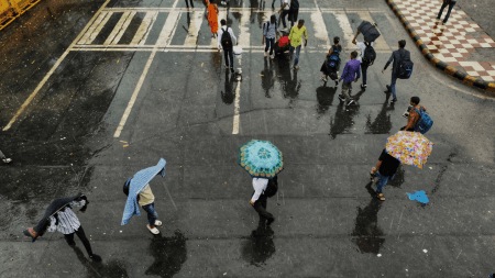 Rain and waterlogging at Anand Vihar Railway Station, at New Delhi on Friday