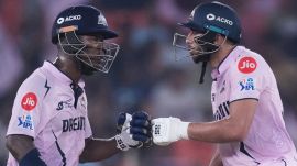 Gujarat Titans' Sherfane Rutherford left, and Shahrukh Khan encourage each other as they bat during the Indian Premier League cricket match. (AP photo)