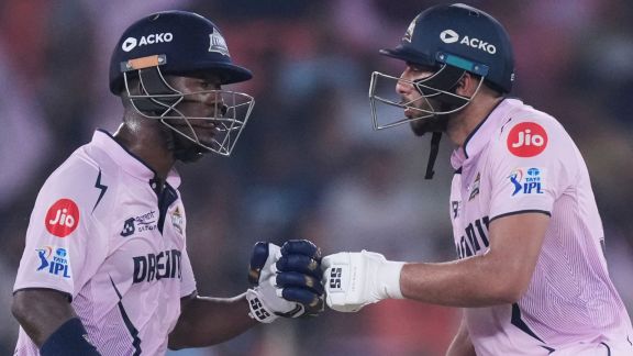 Gujarat Titans' Sherfane Rutherford left, and Shahrukh Khan encourage each other as they bat during the Indian Premier League cricket match. (AP photo)
