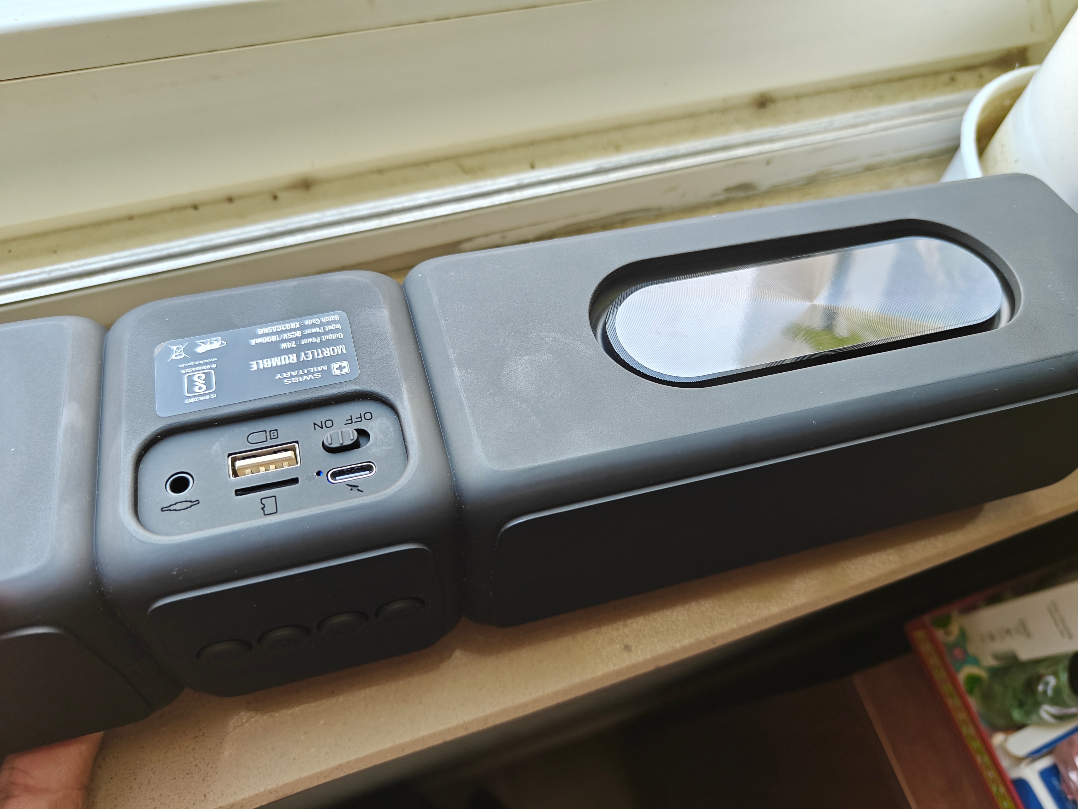 On the back of this control unit is a power button, USB-A and USB-C ports, an SD card reader, and an Aux-in port.
