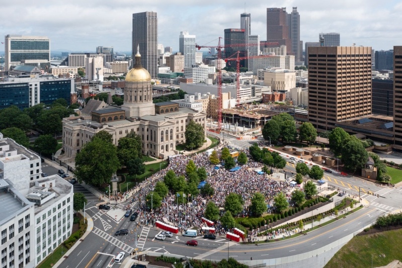 A crowd of protesters fill Liberty Plaza in front of the Georgia State Capitol in Atlanta on Saturday 