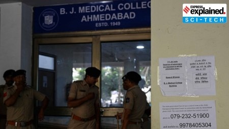 Police stand guard outside the postmortem room and the Kasauti Bhavan (where the DNA samples are being taken), at BJ medical college in Ahmedabad on Saturday.
