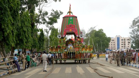 Security personnel stand near the 'chariot' ahead of Lord Jagannath Rath Yatra, in Digha on Friday