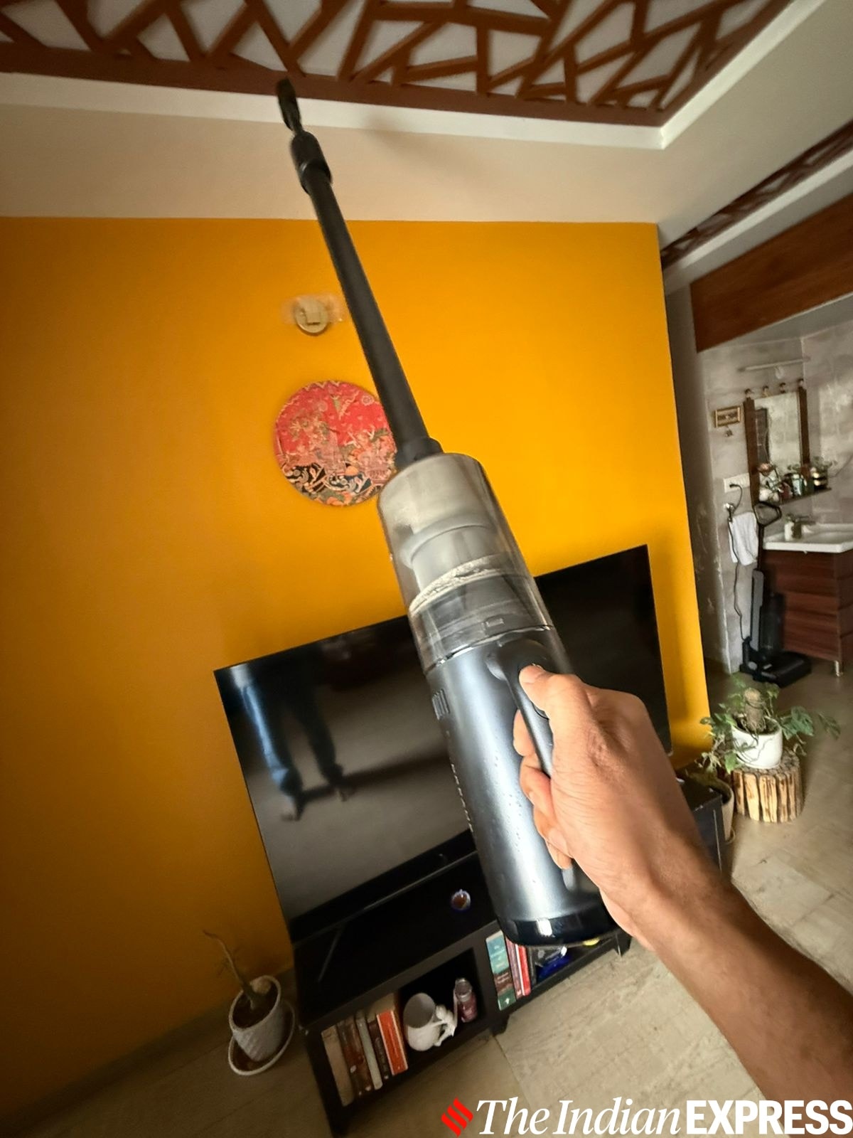 You can take off the motor part of this vacuum cleaner and attach it to a compact storage bin and attachments.