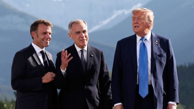 French President Emmanuel Macron, from left, Canada's Prime Minister Mark Carney and U.S. President Donald Trump attend a family photo session during the G7 Summit, in Kananaskis, Alberta, Monday, June 16, 2025