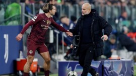 Manchester City's Jack Grealish with manager Pep Guardiola. (Reuters)