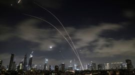 Israeli air defense system fires to intercept missiles during an Iranian attack over Tel Aviv, Israel, early Wednesday