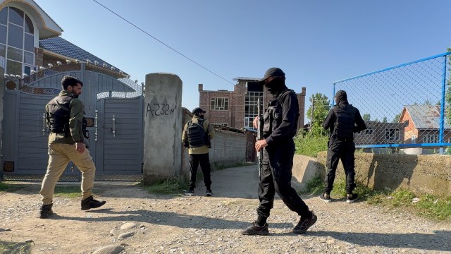A National Investigation Agency team conducts raid at a locations in in Kulgam on Thursday
