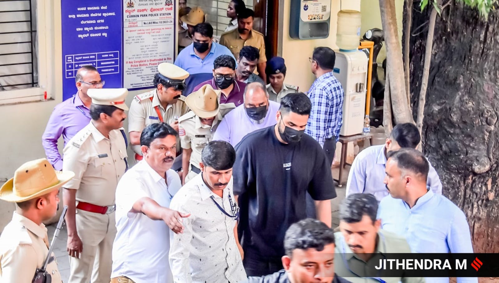 RCB marketing head Nikhil Sosale (in black), officials from the event management company being taken for medical tests following their arrest