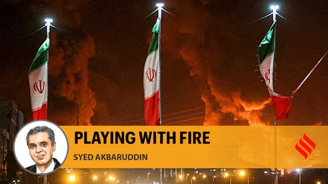 Iranian flags fly as fire and smoke from an Israeli attack on Sharan Oil depot rise, following Israeli strikes on Iran, in Tehran. (Reuters)