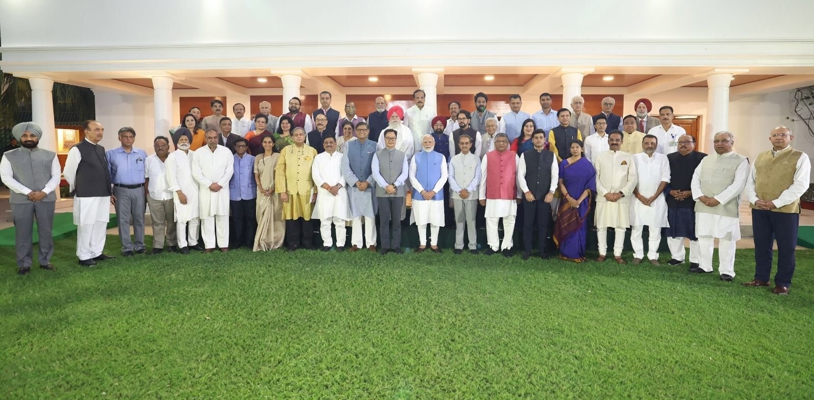 Prime Minister Narendra Modi with members of multi-party delegations which visited various nations, at his residence in New Delhi on Tuesday