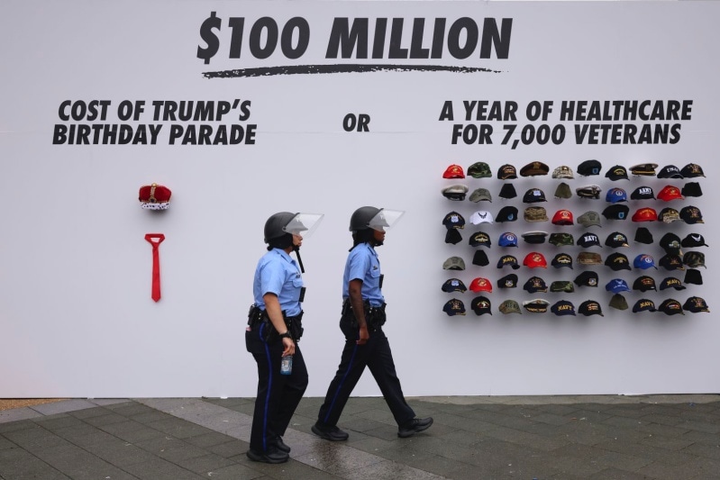 Police officers patrol the area around a No Kings protest in Philadelphia 