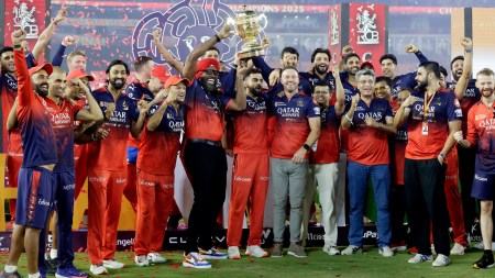 Royal Challengers Bengaluru (RCB)'s players celebrate after winning their IPL trophy