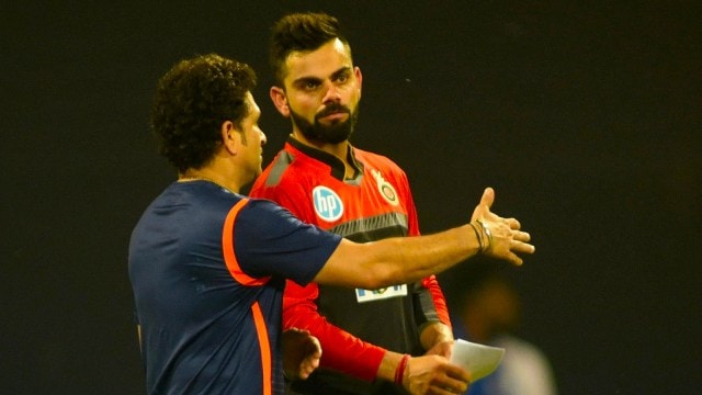 File image of Sachin Tendulkar in conversation with RCB captain Virat Kohli before an IPL cricket match. (Express Photo by Kevin D'Souza)