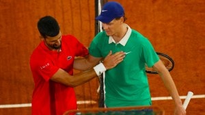 Jannik Sinner, right, and Novak Djokovic greet each other after their semifinal match of the French Tennis Open at the Roland-Garros stadium in Paris on June 6, 2025. (AP Photo)