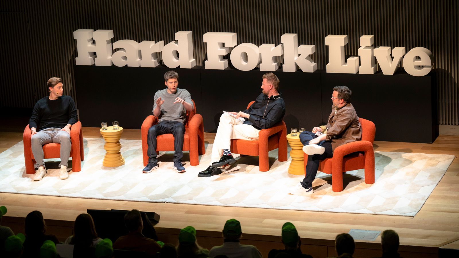 From left: Brad Lightcap, OpenAI chief operating officer; Sam Altman, OpenAI chief executive; and the hosts of the “Hard Fork” podcast, Casey Newton and Kevin Roose, during a live recording of “Hard Fork” at the SFJAZZ Center in San Francisco, June 24, 2025. (Mike Kai Chen/The New York Times)