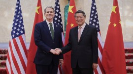 Chinese Vice Premier He Lifeng (right) shakes hands with US Treasury Secretary Scott Bessent before their meeting to discuss China-US trade, in London on Monday