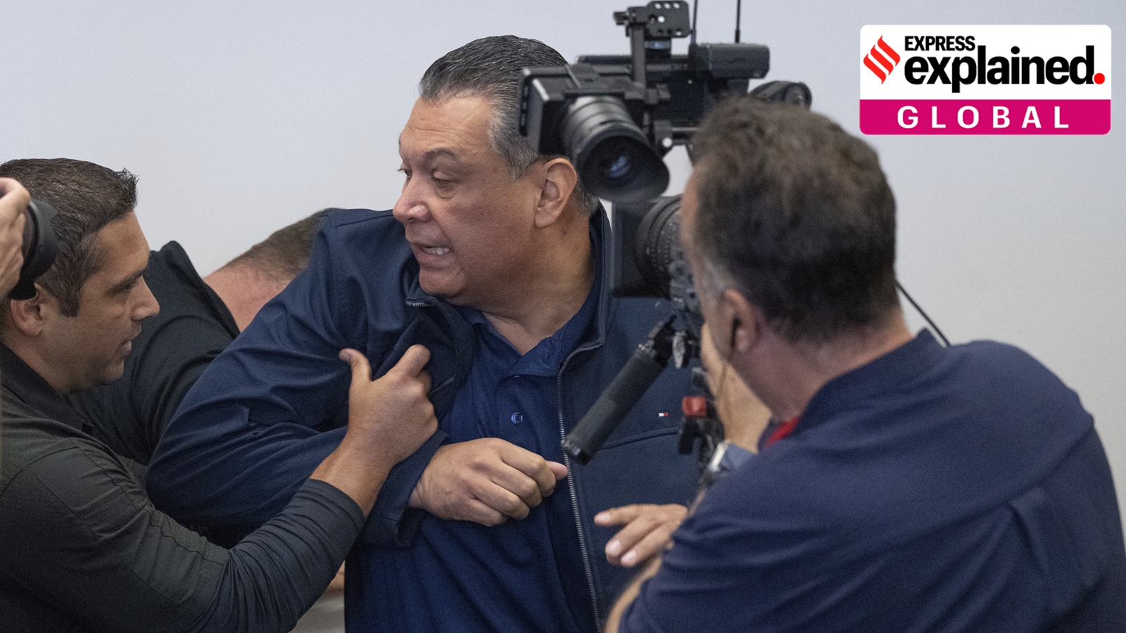 U.S. Sen. Alex Padilla, D-Calif., is pushed out of the room as Homeland Security Secretary Kristi Noem holds a news conference regarding the recent protests in Los Angeles, Thursday, June 12, 2025.