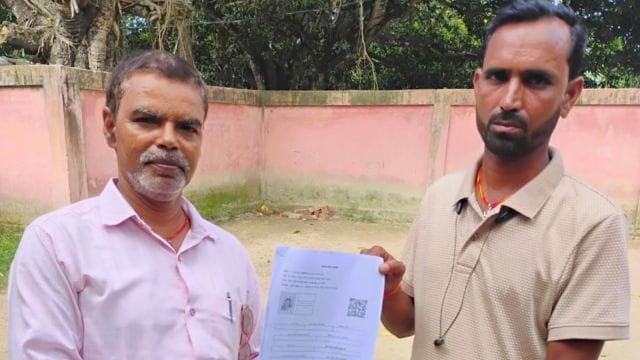 A voter receiving their enumeration form from BLO under the Special Intensive Revision in Bihar's Katihar. (Credit: X/@ECISVEEP)