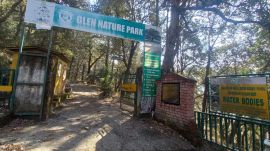 The tattered remains of a signboard at the entry gate of Glen Nature Park in Shimla.