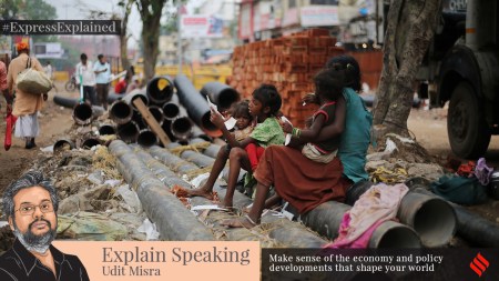 Poverty in India: Children attending to their younger siblings near the Red Fort in Old Delhi.