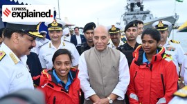 Defence Minister Rajnath Singh with Lt Cdr Dilna K and Lt Cdr Roopa A after they return to Goa onboard INSV Tarini on May 29. (Photo: X/@indiannavy)