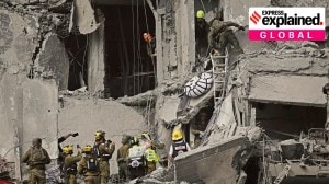 Israeli soldiers and rescue workers carry a body from a residential building destroyed by an Iranian missile strike that killed several people, in Beersheba, Israel, on Tuesday, June 24, 2025.