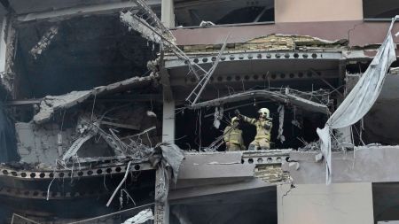 Firefighters work the scene of an explosion at a residence compound in northern Tehran